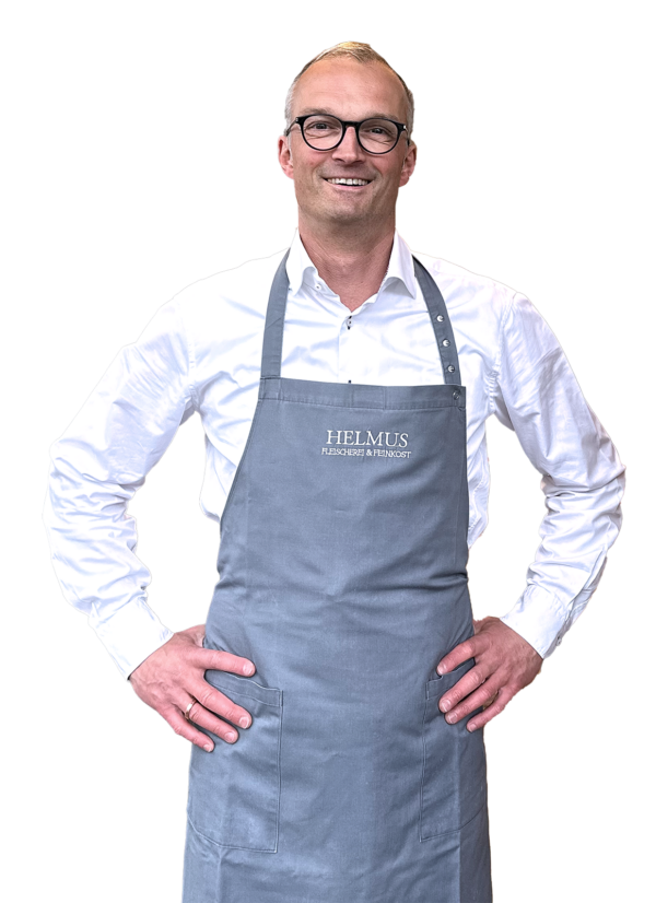 Stephan Helmus, der Inhaber, lächelt in die Kamera und strahlt Freundlichkeit aus.  